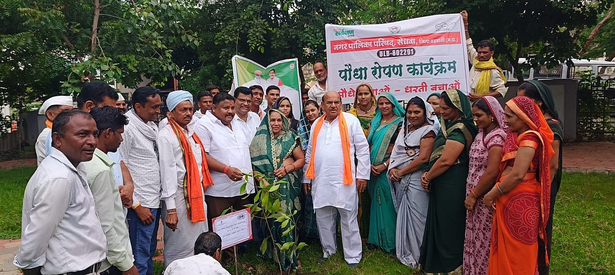 Scheduled Tribes Commission chairman Antar Singh Arya plants a sapling
